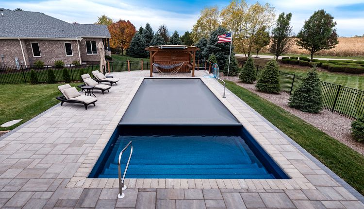 Coverstar automatic cover installed on a backyard swimming pool